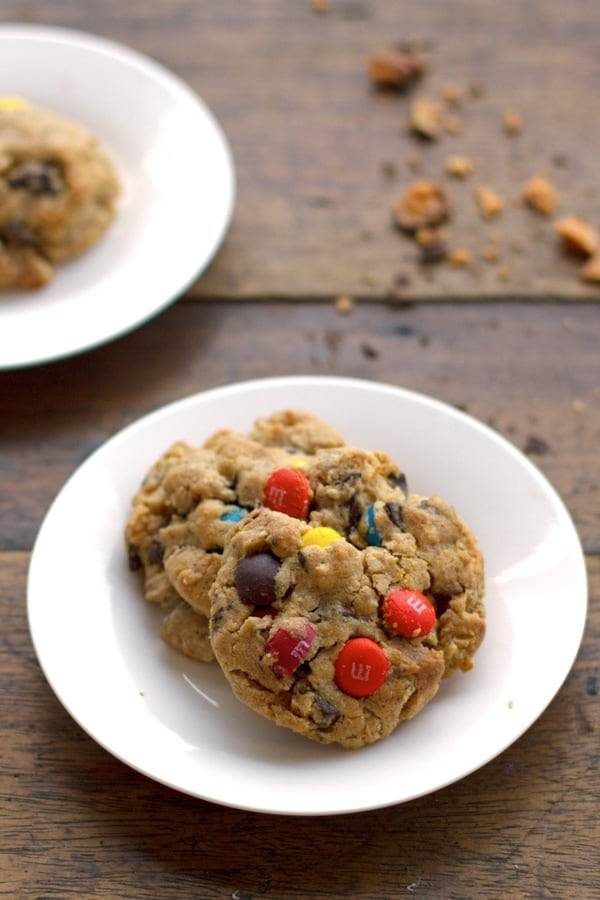Butterfinger monster cookies on a white plate.