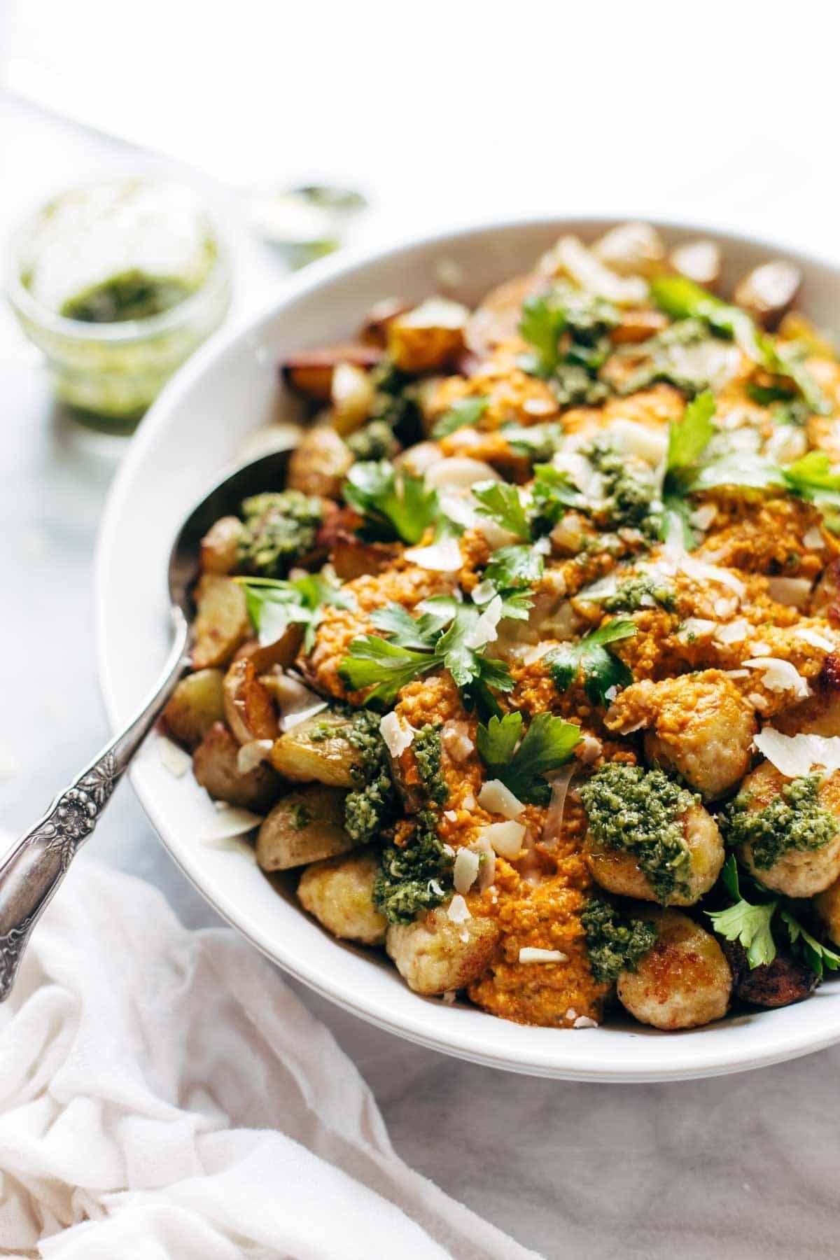 Meatballs in a bowl with a spoon.