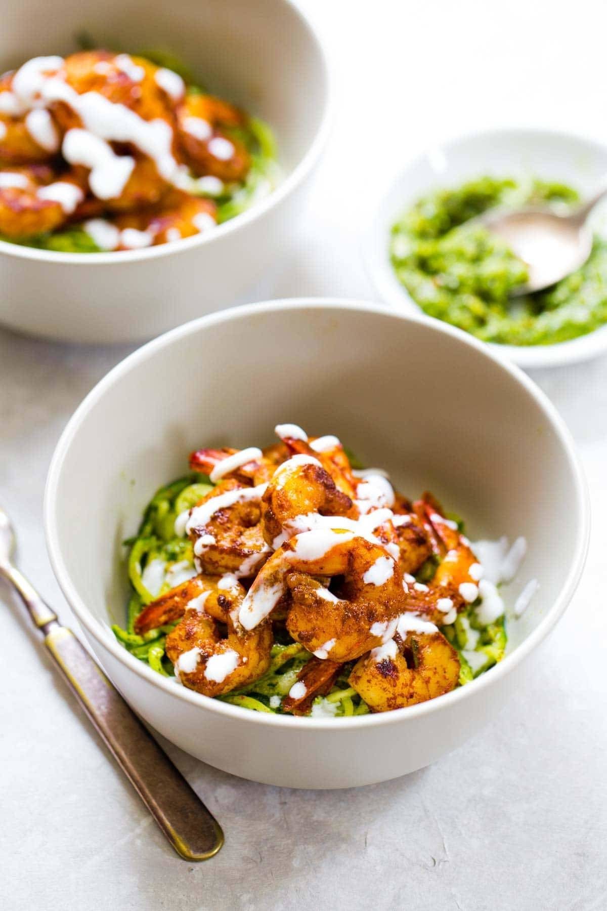 Spicy Shrimp with Pesto Noodles in two bowls.