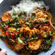 Shrimp curry in a bowl with rice.