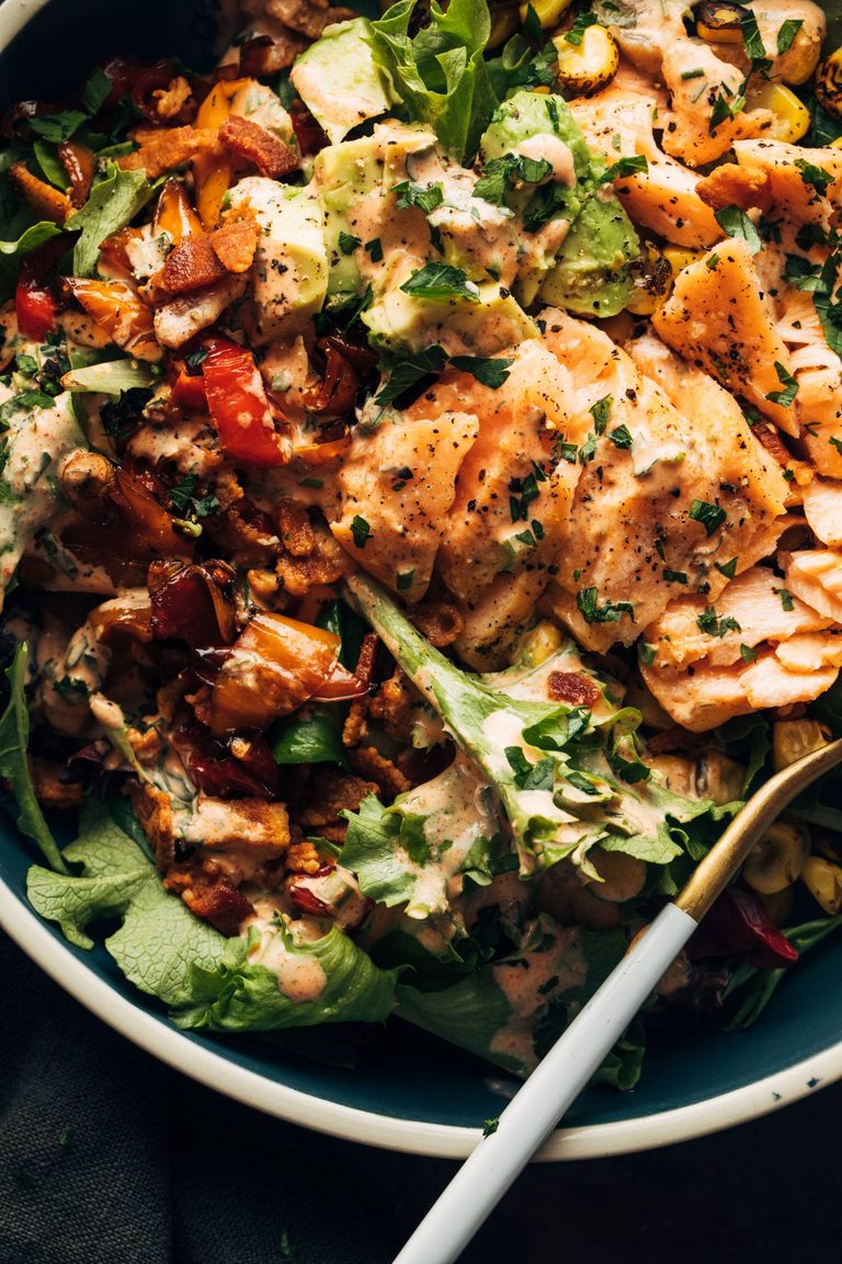 Salad with salmon on top.